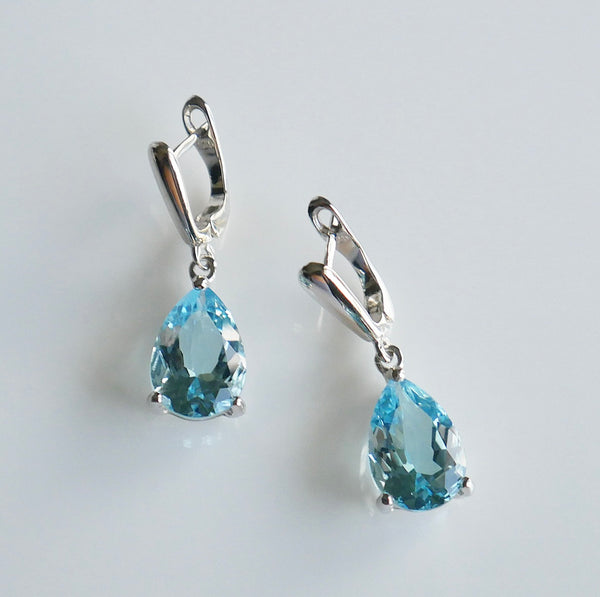 Blue gemstone earrings, blue crystal earrings, topaz earrings, waterdrop topaz earrings, tear drop earrings, blue tear drop earrings, wedding jewelry, wedding earrings, blue earrings for wedding, blue event earrings, December birthstone earrings, blue sterling silver crystal earrings, topaz jewelry, shopping in Miami, jewelry store in Miami, things to do in Miami, shopping in brickell