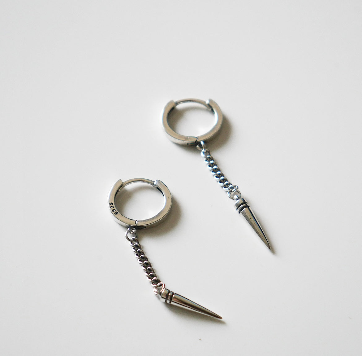 earrings, silver earrings, jewelry, statement earrings, accessories, fashion jewelry, cool earrings, trending jewelry, Trending on tik tok, fine jewelry, christmas gifts, birthday gifts, anniversary gifts, dangly earrings, earrings with a bullet, earrings with a spike, dagger jewelry, cool silver jewelry, small hoop earrings for men, spike earrings, spike hoop earrings, bullet earrings, sterling silver bullet earrings, jewelry in Miami, shopping in Brickell, jewelry store in Brickell, jewelry store in Miami