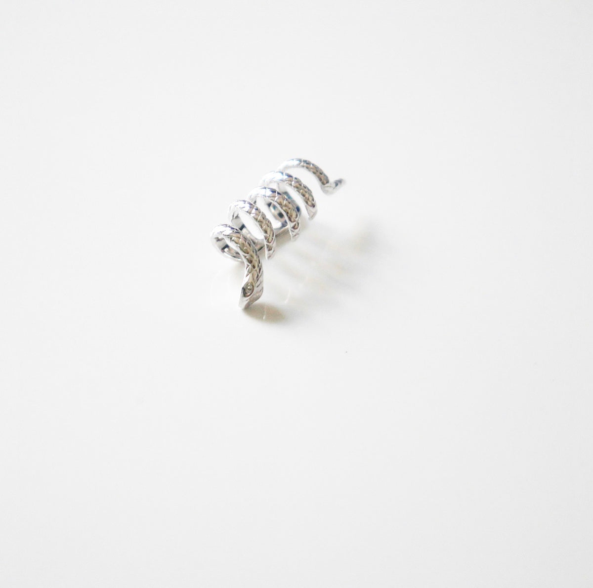 ear cuffs, cuff earrings, snake cuff earrings, silver ear cuffs, silver jewelry, statement jewelry, cooll earrings, designer earrings, earrings, silver earrings, fine jewelry, trending on tiktok, fashion jewelry, fashion accessories, cool ear cuffs, snake jewelry, snake earrings, cool snake ear cuffs, trending jewelry, birthday gifts, designer jewelry, cool ear cuffs, snake jewelry, expensive jewelry